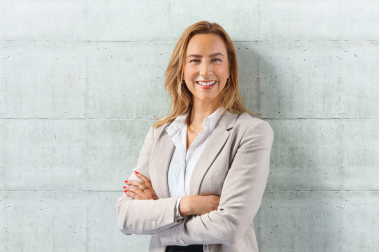 business woman lean on wall with copyspace at right side